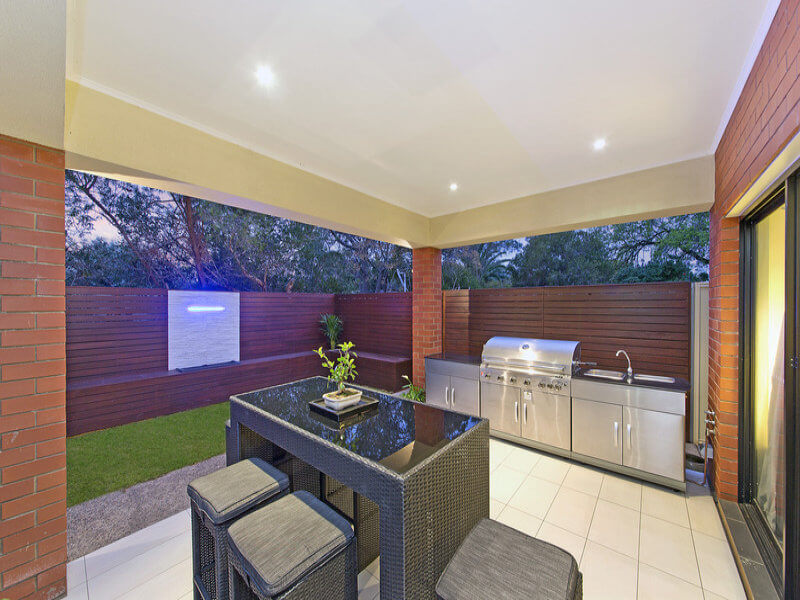 Custom outdoor kitchen with weather-resistant cabinetry and built-in BBQ on York Street